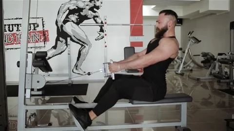 Man workout with power simulator in the gym Stock Footage 56635895