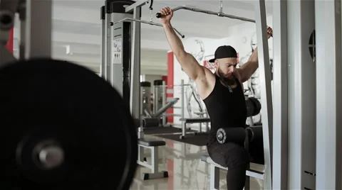 Man workout with power simulator in the gym Stock Footage 56637255