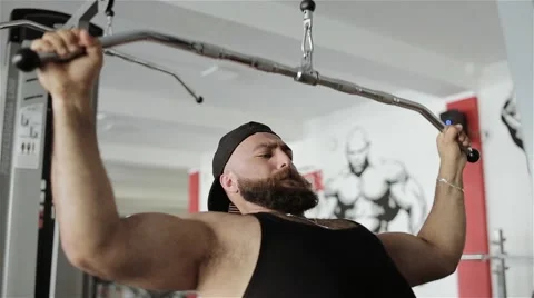 Man workout with power simulator in the gym Stock Footage 56637266