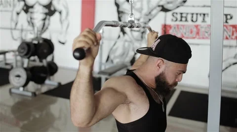 Man workout with power simulator in the gym Stock Footage 56637276