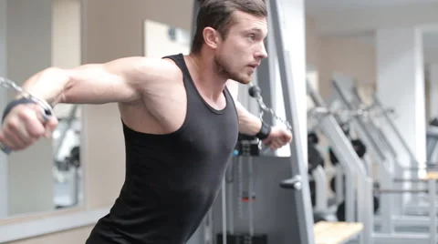 Man workout with power simulator in the gym Stock Footage 62562511