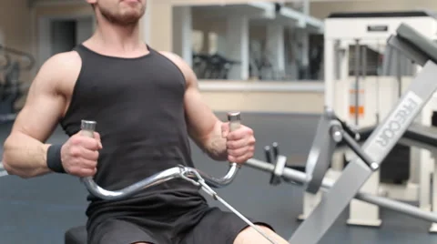 Man workout with power simulator in the gym Stock Footage 62562807