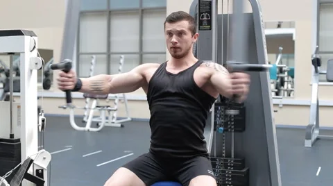 Man workout with power simulator in the gym straight rflection mirror Stock Footage 62562899