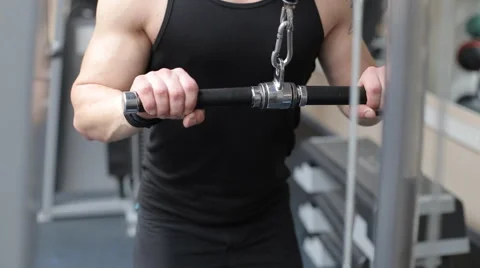 Man workout with power simulator in the gym Stock Footage 62563371