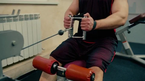 Man workout with power simulator in the gym Stock Footage 81278449