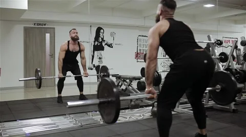 Man workout rod in the gym Stock Footage 56636997