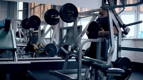 Man workout with simulator platform in the gym Stock Footage 70452158