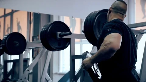 Man workout with simulator platform in the gym Stock Footage 70452353