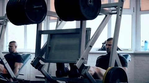 Man workout with simulator platform in the gym Stock Footage 70454475