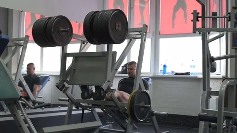 Man workout with simulator platform in the gym Stock Footage 70454476