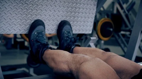 Man workout with simulator platform in the gym Stock Footage 70454659