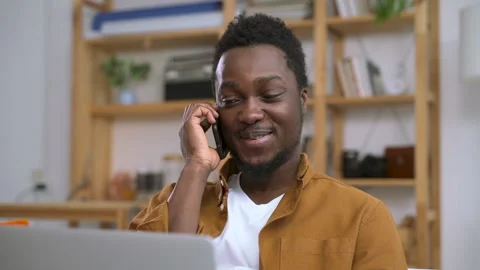 Man at workplace make phone call and tell funny story joke Spbas. Smiling Stock Footage 147650893