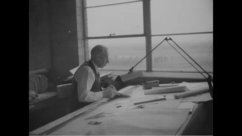 Man works at architect table; men working on blueprints at tables - 1940 Stock Footage 107104190