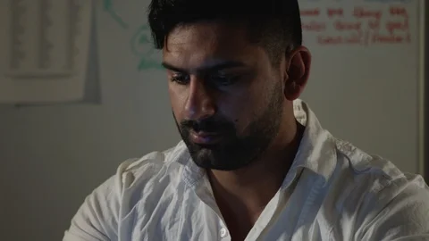Man Works Back Late in Dark Office at Night, Types on Computer, Pan to Keyboard Stock Footage 108893135
