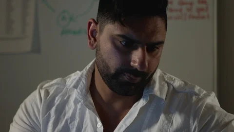 Man Works Back Late in Dark Office at Night, Checks Notes and Types on Computer Stock Footage 108893255