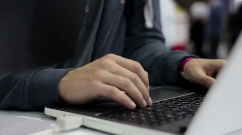 Man Works Behind Laptop Computer Vídeo Stock 68840223