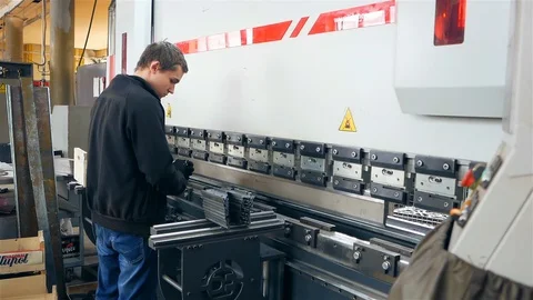 The man works behind the machine Stock Footage 128449945