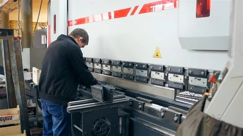 The man works behind the machine Stock Footage 128459486