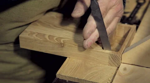 A man works a chisel with a tree Stock Footage 59697163