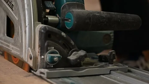 A man works on a circular saw Stock Footage 132782146