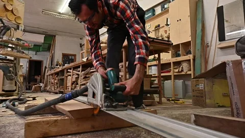 A man works on a circular saw Stock Footage 132782297