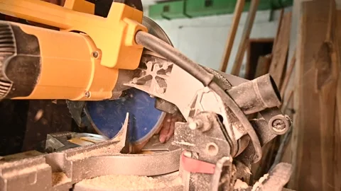 A man works on a circular saw Stock Footage 132783394