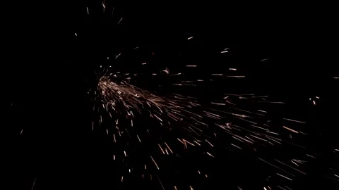 Man works circular saw over the steel. Sparks fly from hot metal on black Stock Footage 170577045