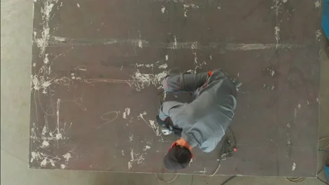 Man works circular saw. Work in the factory Stock Footage 167134253