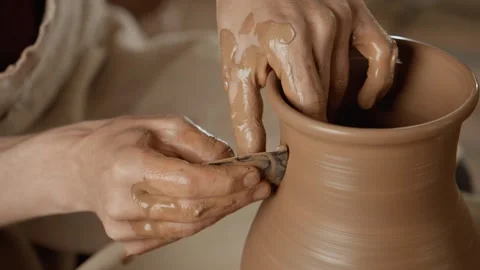 Man works with clay. Working process in ceramic workshop. Potter making vase Stock Footage 247432930