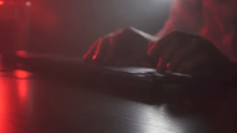 A man works at a computer and drinks water Stock Footage 119452753