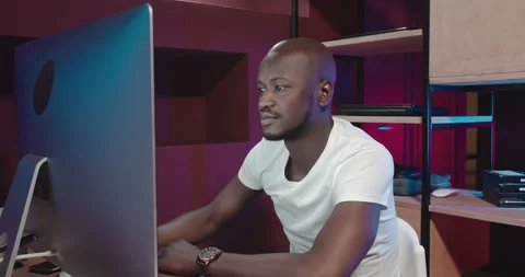 A man works at a computer and is surprised Video stock 154981673