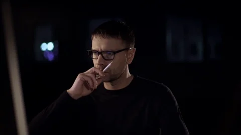 	The man works on the computer. The dark studio. Designer. Constructor. Architec Stock Footage 77675359