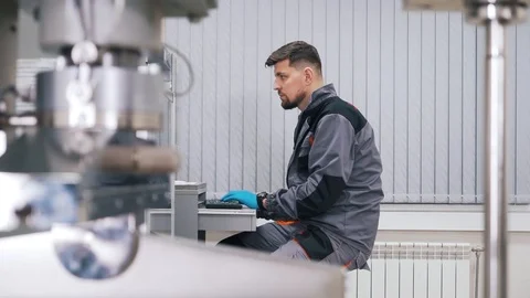 A man works at a computer in the laboratory Stock Footage 112152507