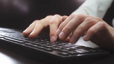 Man works at the computer late at night Stock Footage 118935960