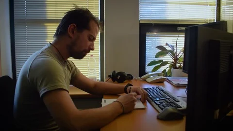 Man works with computer in the office Stock Footage 71042032