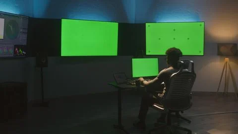A man works on computer in studio with equipment Foto stock