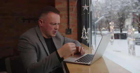 The man works at the computer. Talk to a customer online Stock Footage 171478863