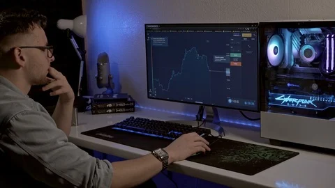 A man works at a computer. trader works on the stock exchange. Stock Footage 127057781