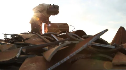 A man works at a construction site with a laser machine for cutting metal. Stock Footage 131864925