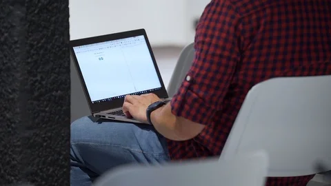 Man works with data on laptop Stock Footage 85949313