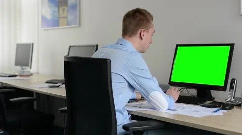 Man works on desktop computer in the office - typing on keyboard - green screen Stock Footage 49836964