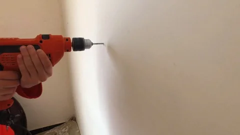 A man works with a drill. Stock Footage 88386948