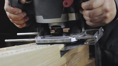A man works with a drill in his workshop Stock Footage 194681565