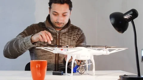 A man works with a drone Stock Footage 87569852