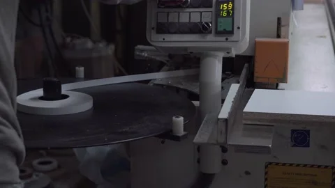 Man works on edge banding machine. Stock-Footage 145991982