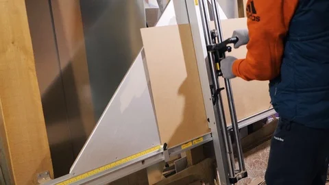 A man works in a framing studio. Stock Footage