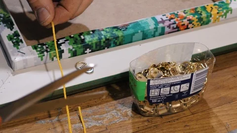 A man works in a framing studio. 库存影片 101953070