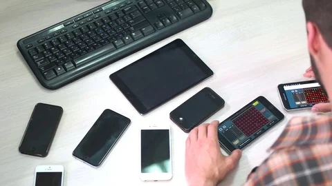 A Man works with gadgets Stock Footage 75619868