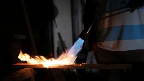 A man works with a gas torch Stock Footage 99592226