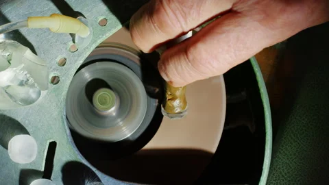 A man works in gem studio cutting and faceting stones Video stock 165755170